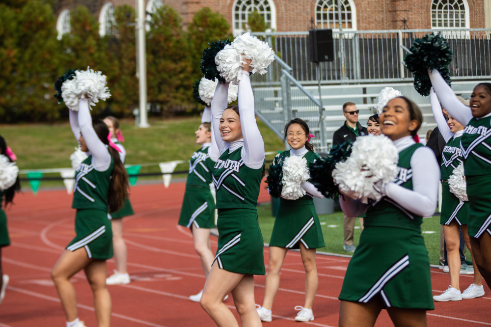 Cheerleaders at a homecoming football game.