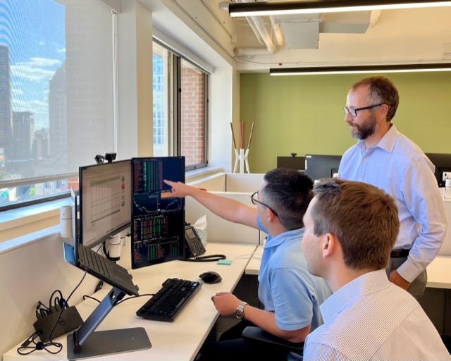 team members collaborating at desk