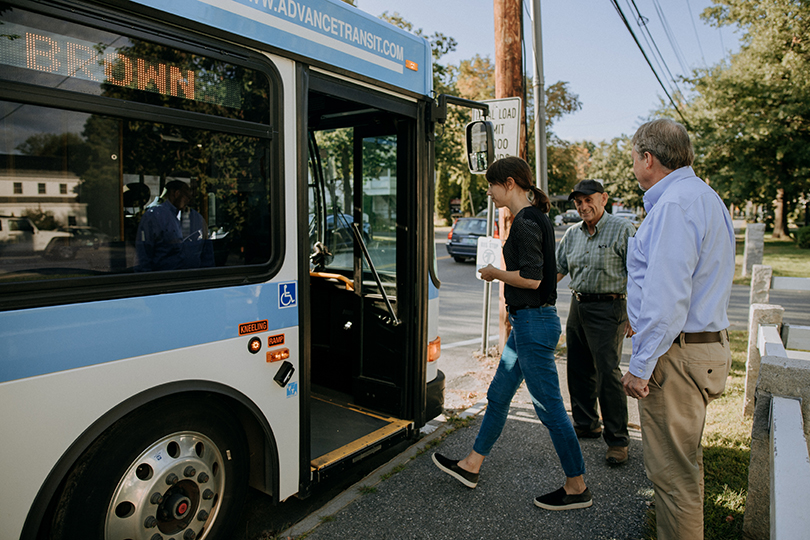 People board an Advance Transit bus.